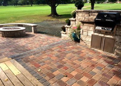 Paver patio with built-in grill and fire pit.